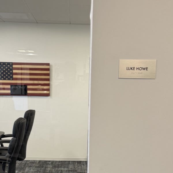 Premium Stainless Steel Room Signs for The Amatriot Group: Elevating a Modern Office Space
