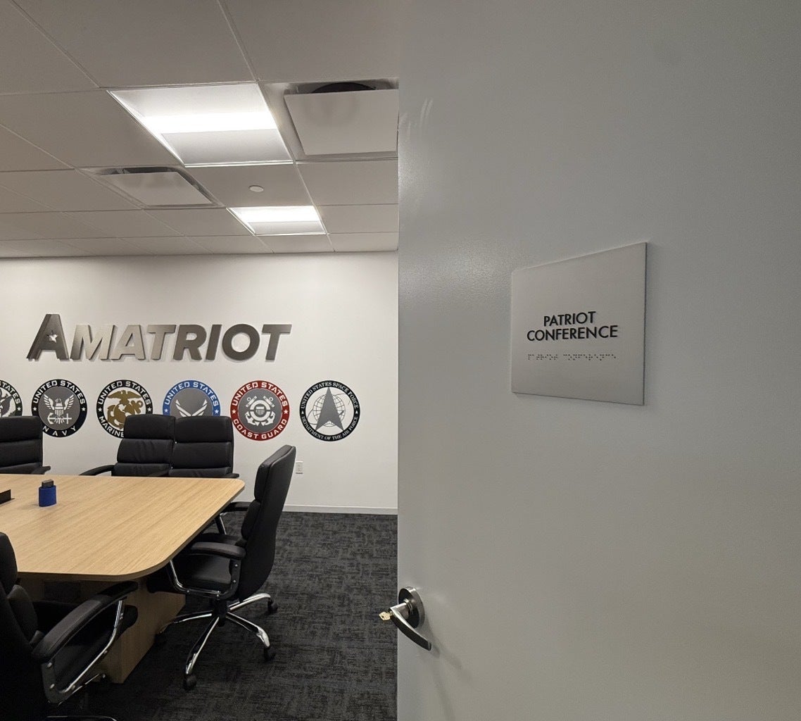 Premium Stainless Steel Room Signs for The Amatriot Group: Elevating a Modern Office Space