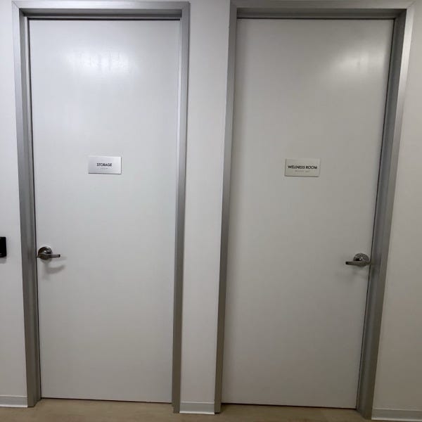 Premium Stainless Steel Room Signs for The Amatriot Group: Elevating a Modern Office Space
