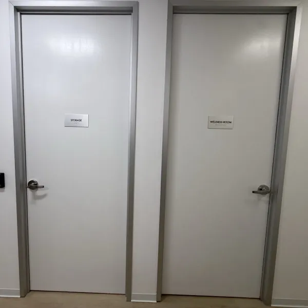 Premium Stainless Steel Room Signs for The Amatriot Group: Elevating a Modern Office Space