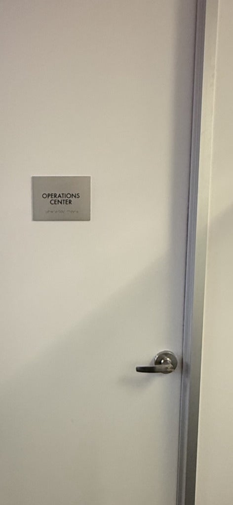Premium Stainless Steel Room Signs for The Amatriot Group: Elevating a Modern Office Space