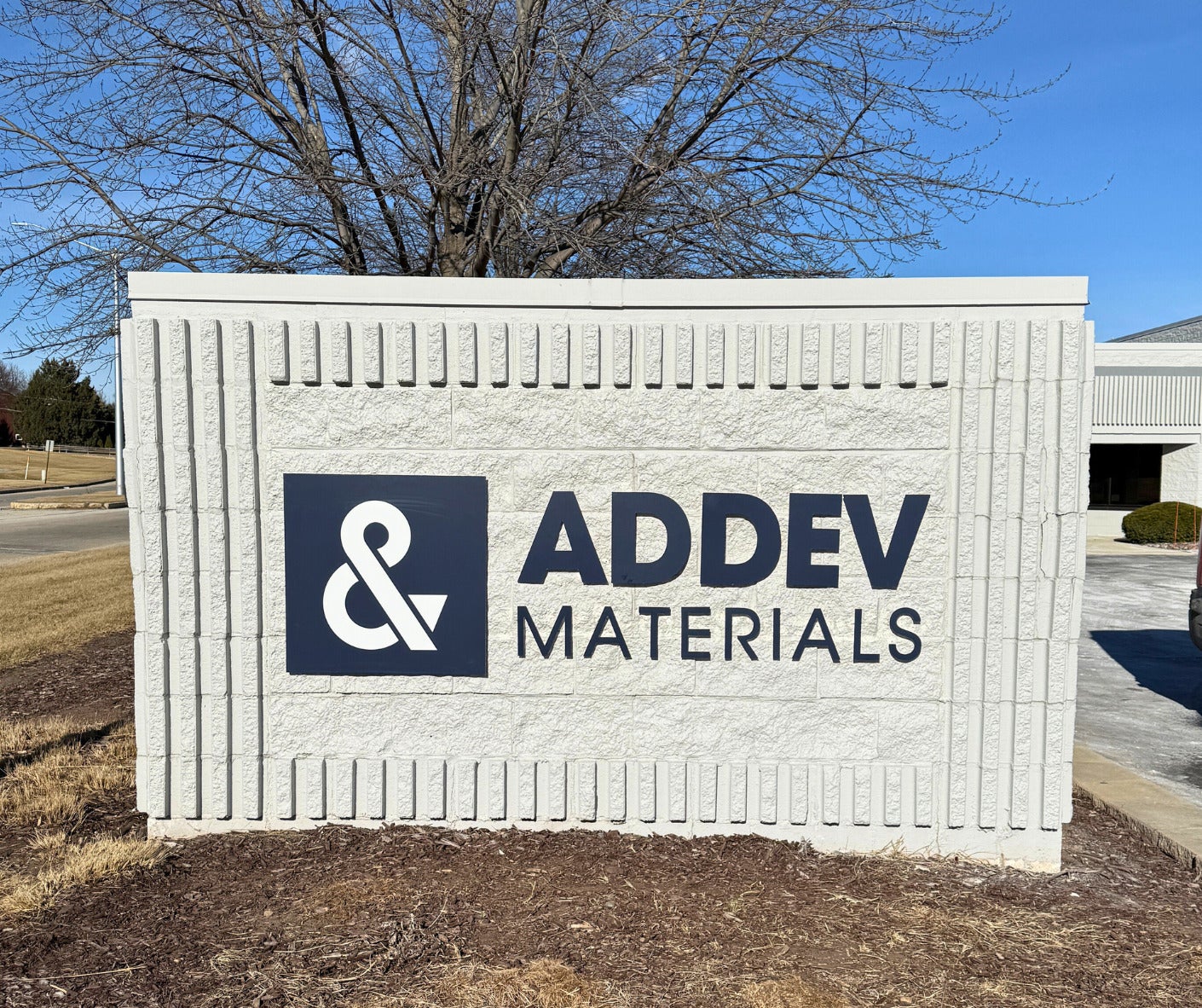 monument sign: addev materials