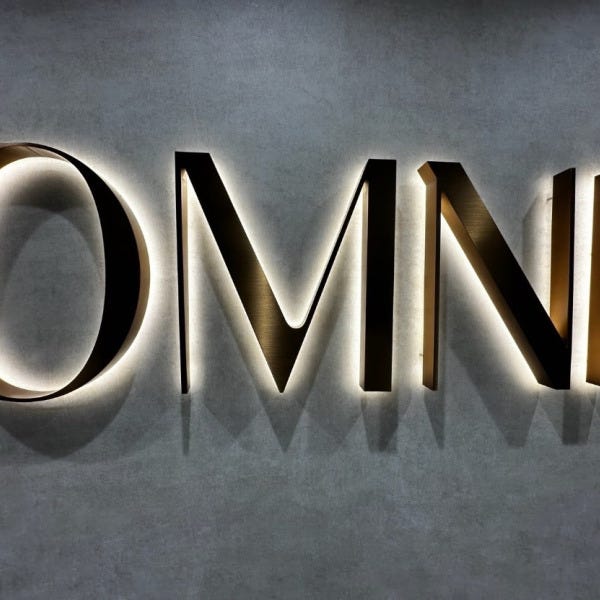 Halo-Lit Satin Gold Stainless Steel Letters Installed for OMNI Dental | Custom Interior Signage