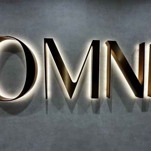Halo-Lit Satin Gold Stainless Steel Letters Installed for OMNI Dental | Custom Interior Signage