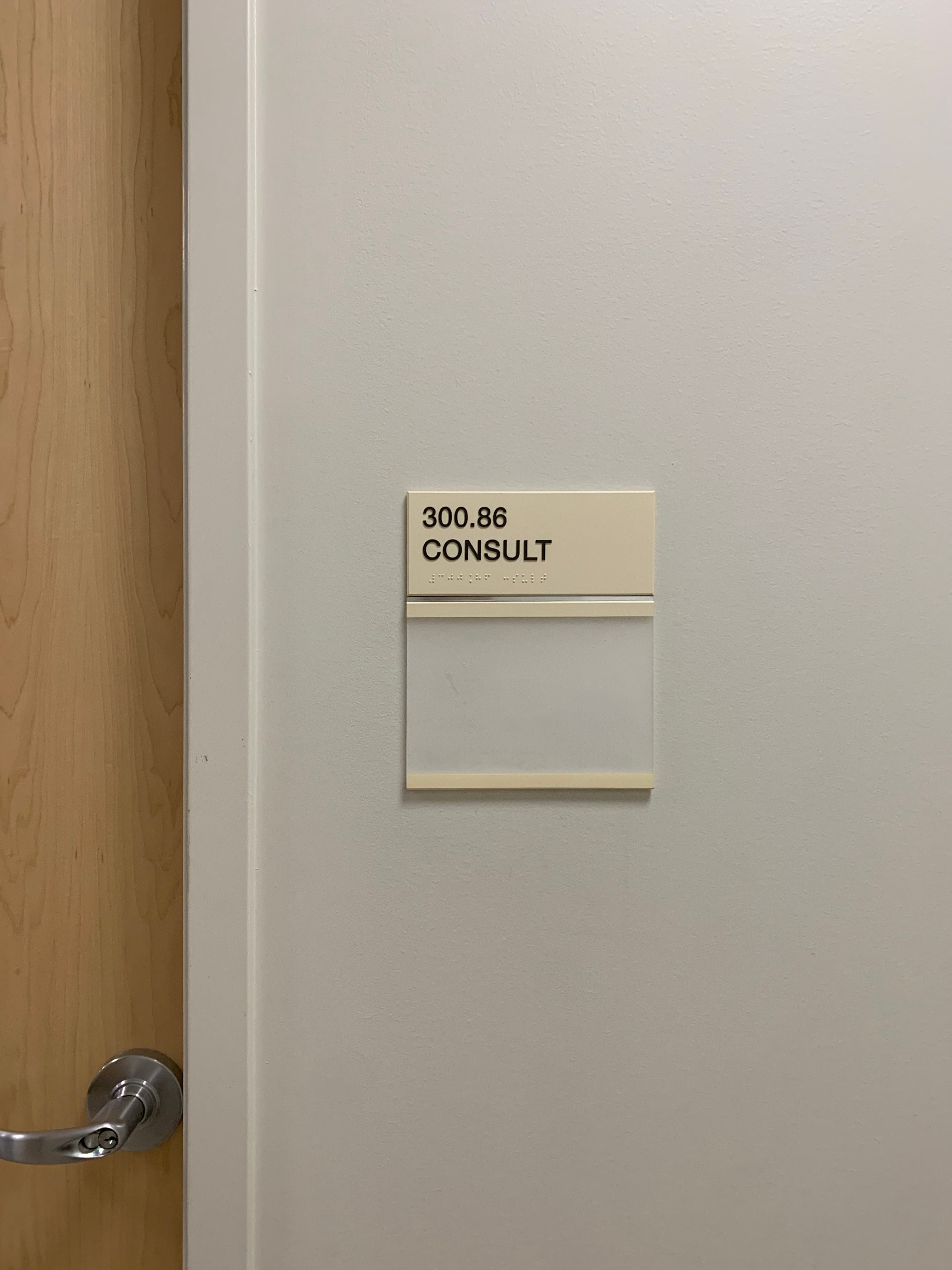 Sutter Health room identification sign with a holder