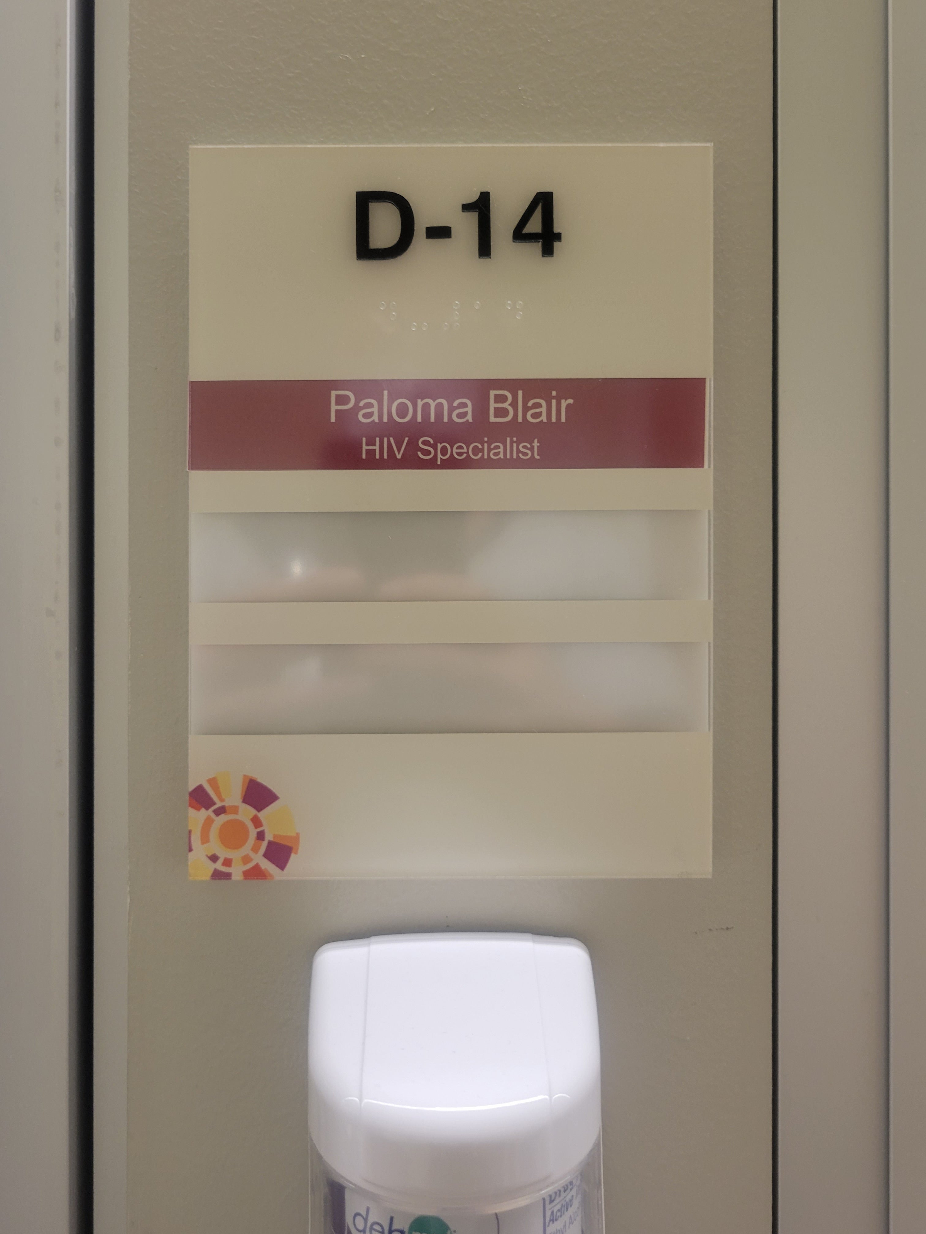 Suite identification sign with two changeable name holders