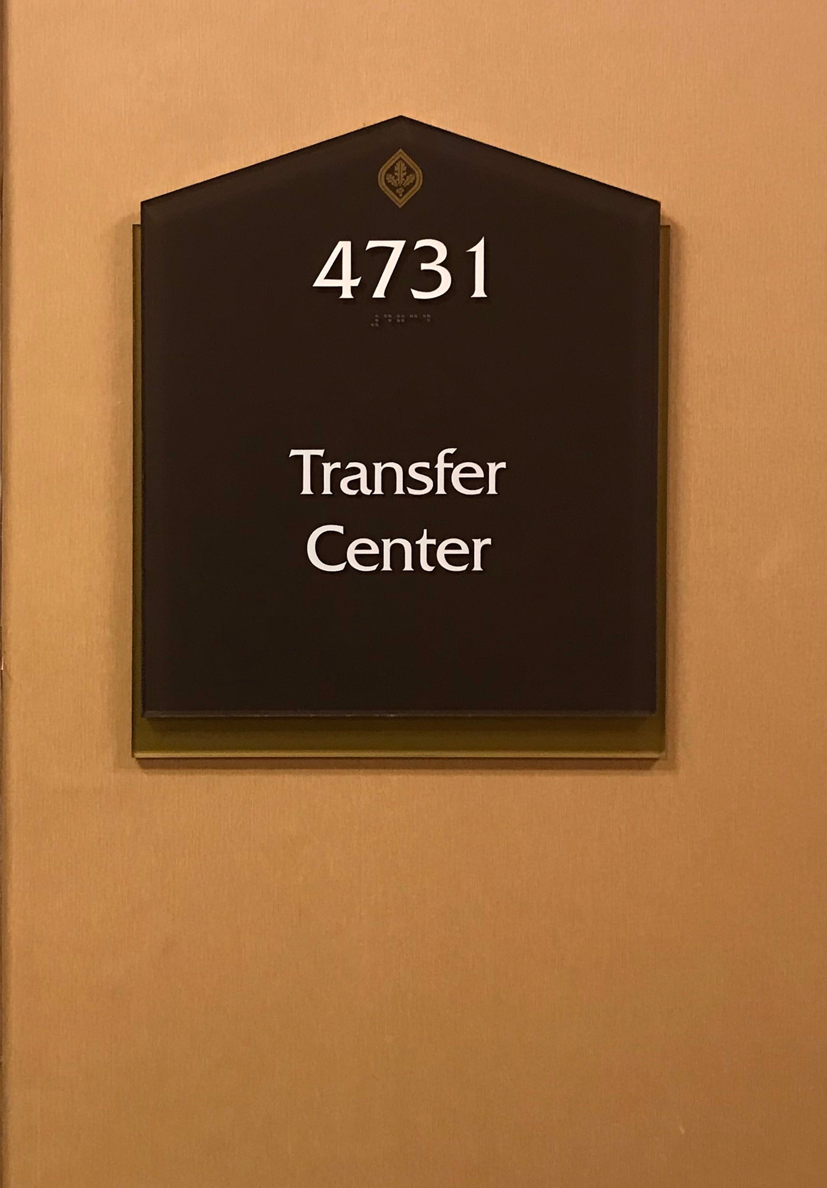 Custom-shaped suite identification sign at Santa Rosa Junior College