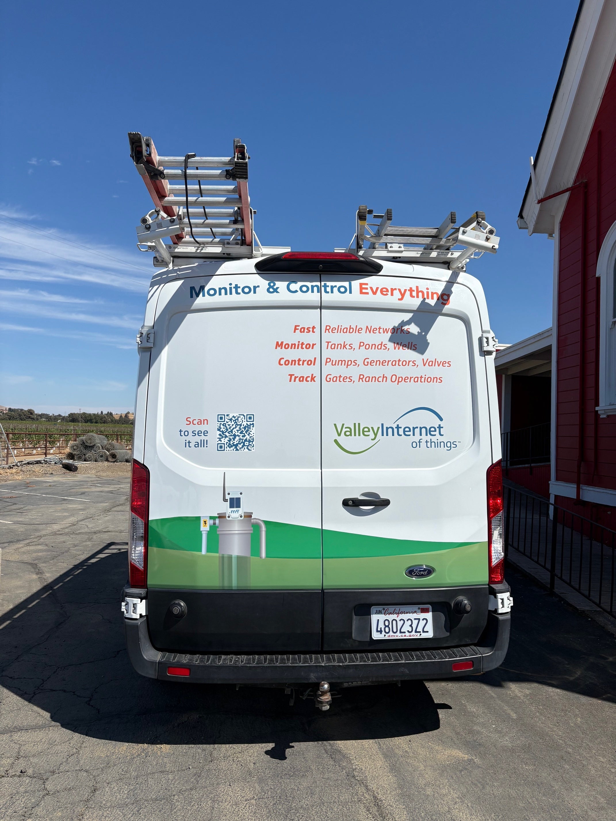 Rear view of a Meter.me and Valley Internet of Things branded van wrap