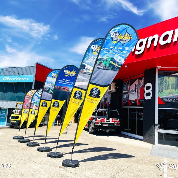 Teardrop flags designed and produced by Signarama Springwood for Ozwide Freight outdoor branding.