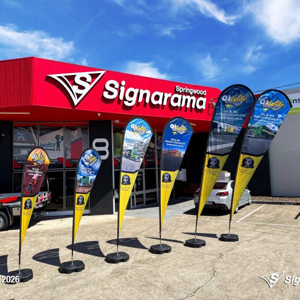 Teardrop flags designed and produced by Signarama Springwood for Ozwide Freight outdoor branding.