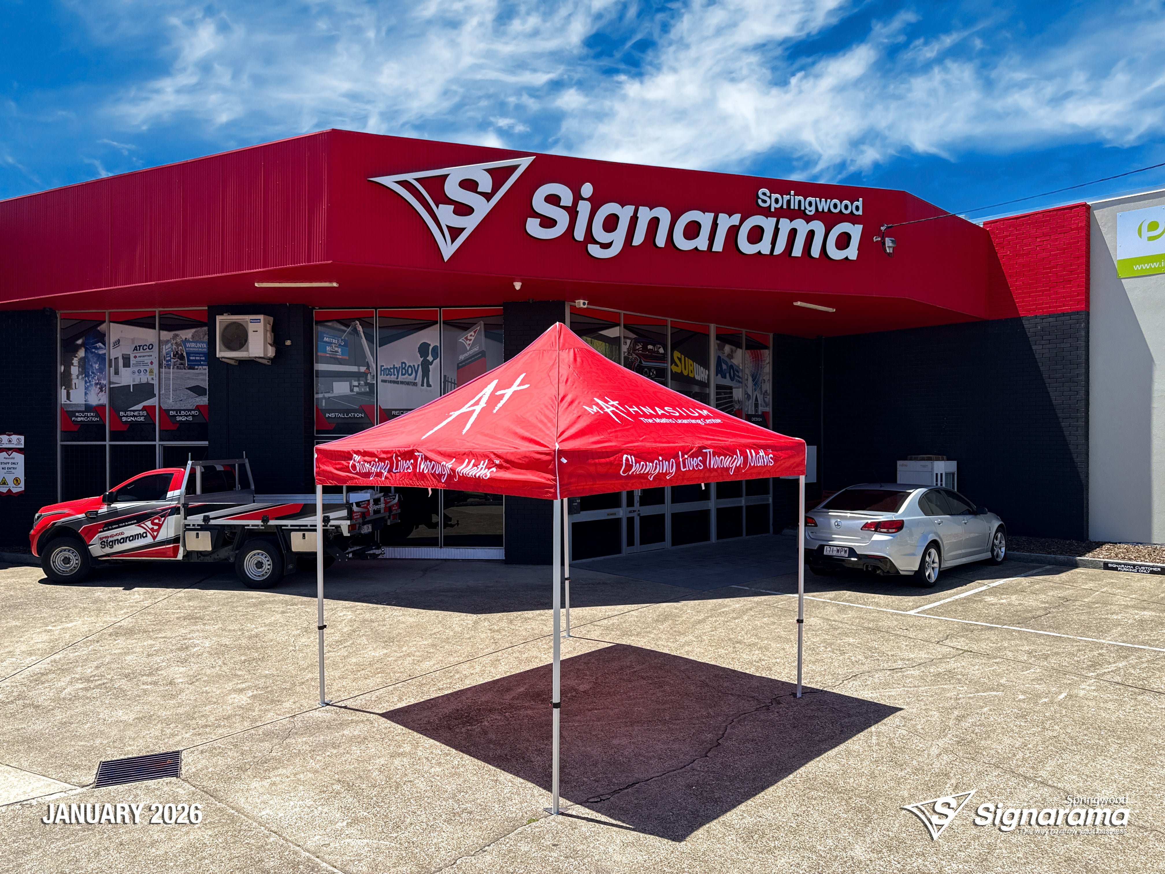 Branded marquee designed and produced by Signarama Springwood for Mathnasium, featuring custom printed event tent used for outdoor promotions, school events and pop-up marketing.