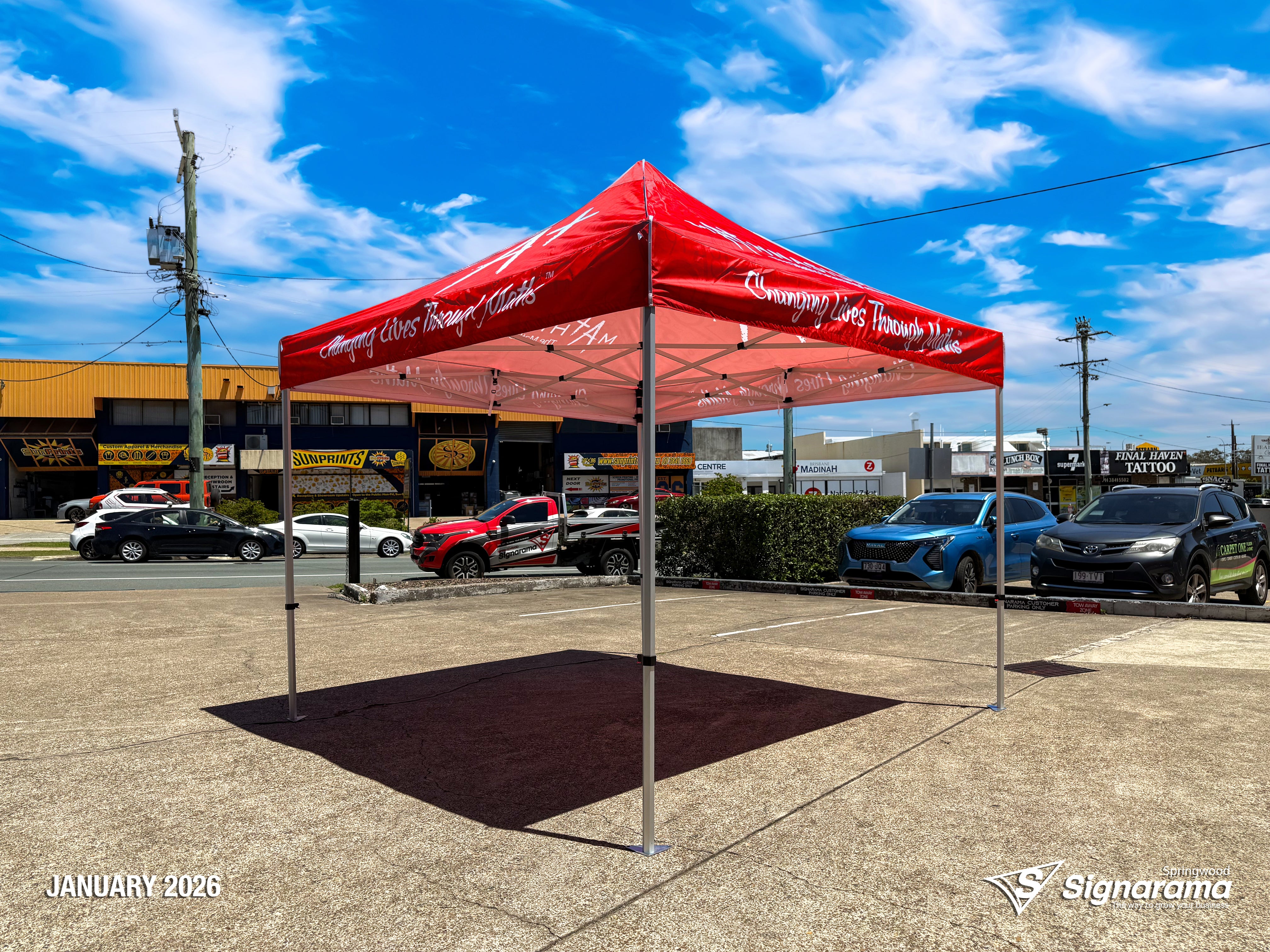 Branded marquee designed and produced by Signarama Springwood for Mathnasium, featuring custom printed event tent used for outdoor promotions, school events and pop-up marketing.