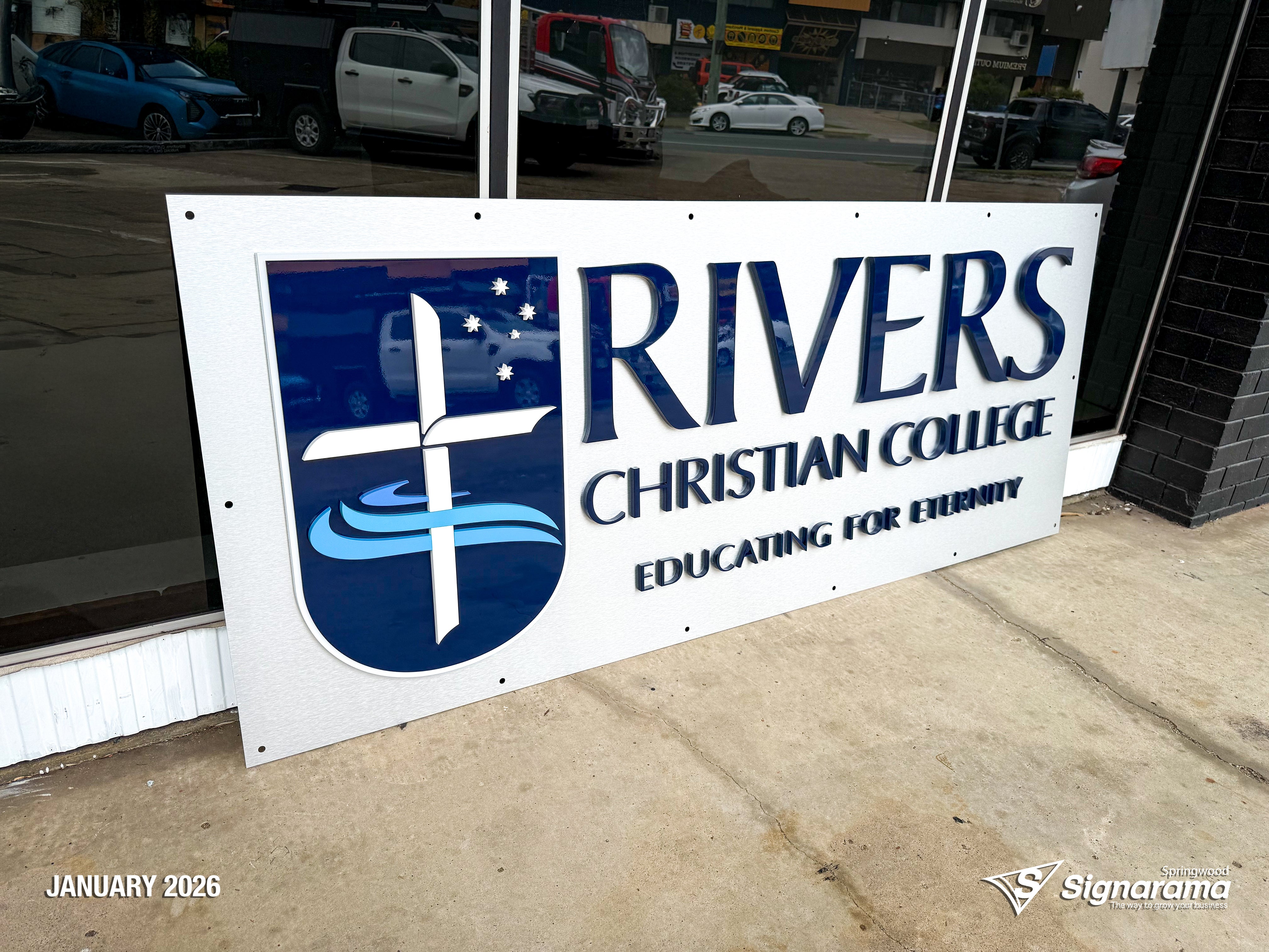 3D acrylic logo signage installed at Rivers Christian College by Signarama Springwood, featuring clean, modern dimensional lettering for a professional school reception display.