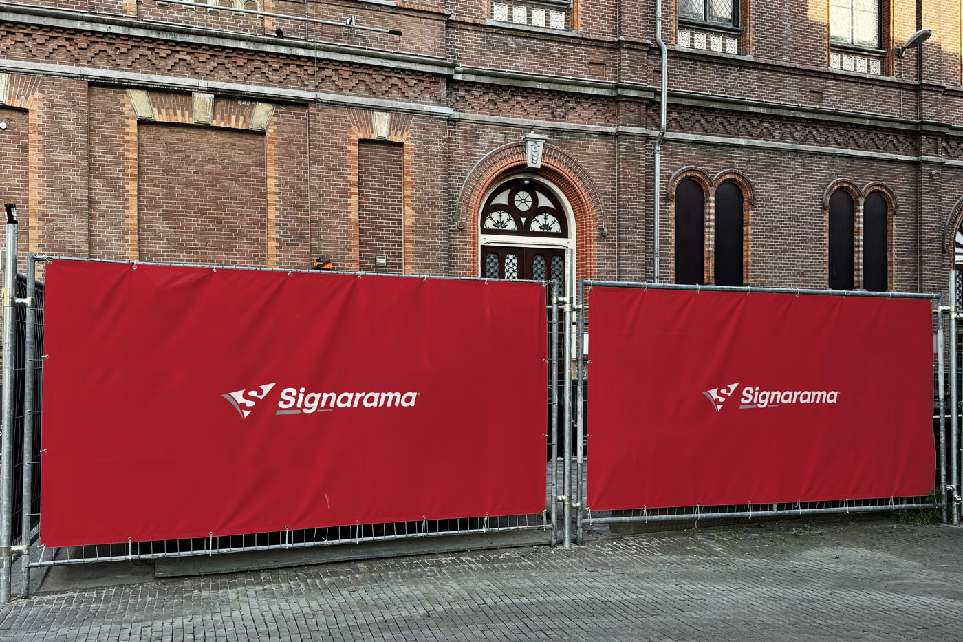 Vinyl banner in place saying Signarama.