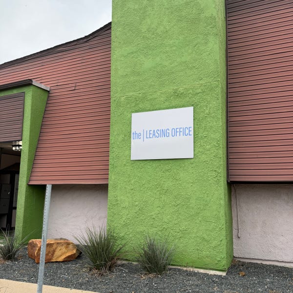 The VIntage Apartments Office Sign