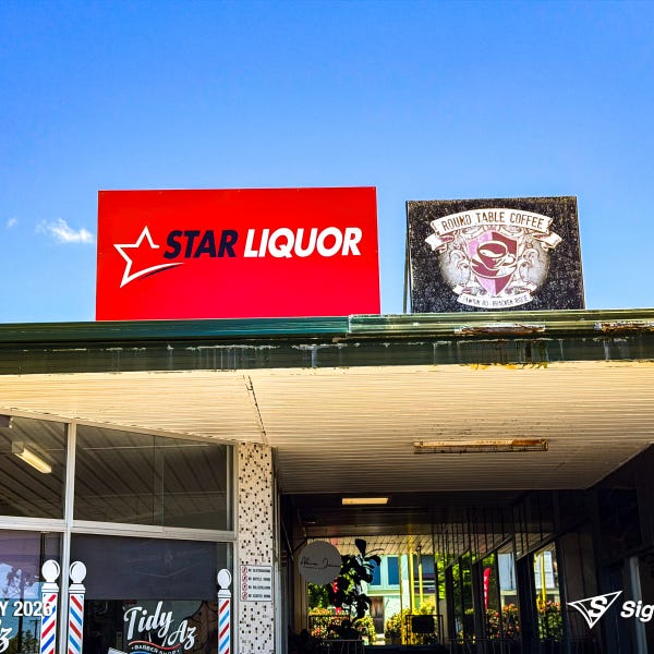 Exterior and interior signage installed by Signarama Springwood at a Star Liquor store, featuring illuminated storefront branding and cohesive in-store graphics for a complete reta...