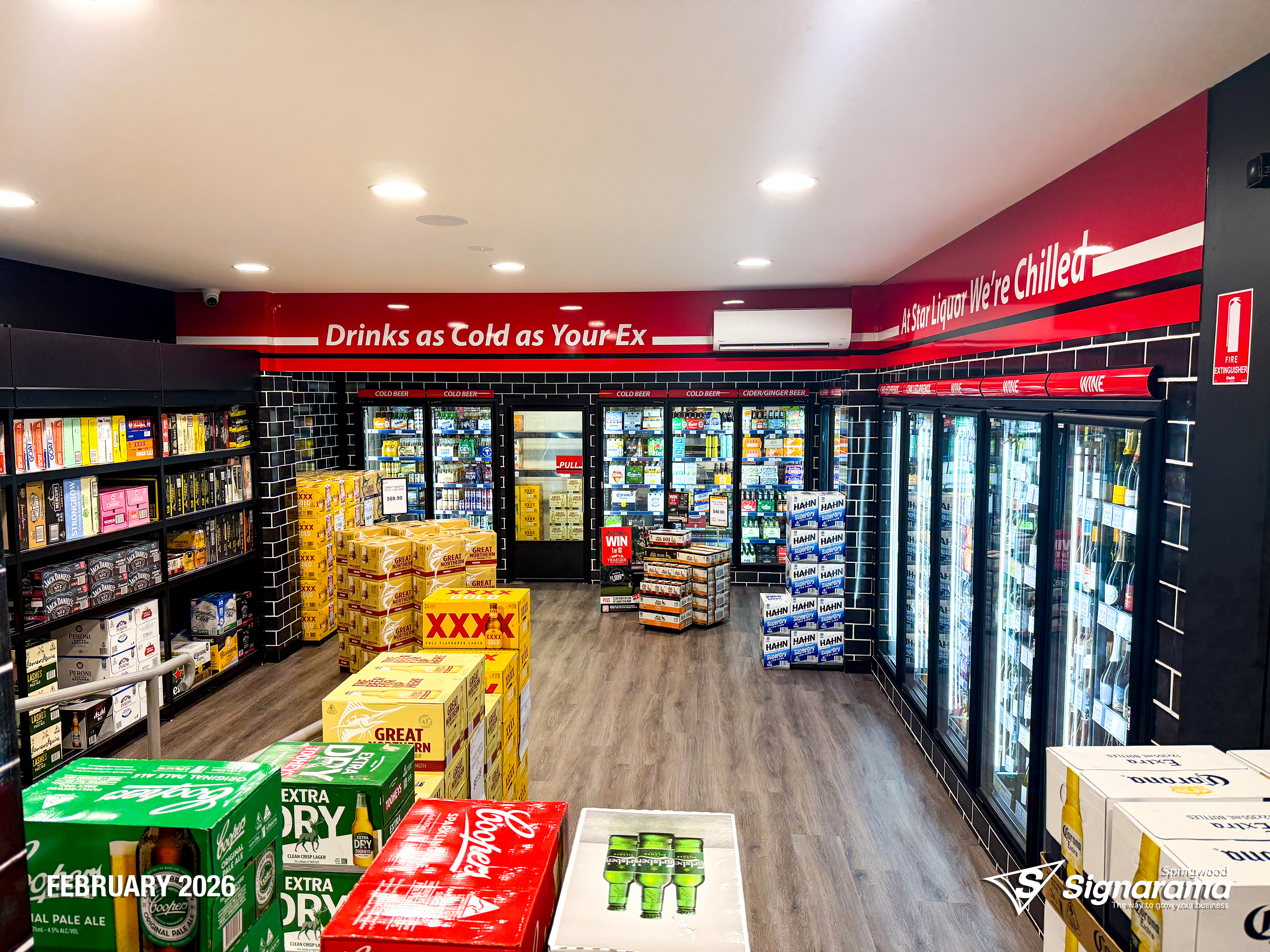 Exterior and interior signage installed by Signarama Springwood at a Star Liquor store, featuring illuminated storefront branding and cohesive in-store graphics for a complete reta...
