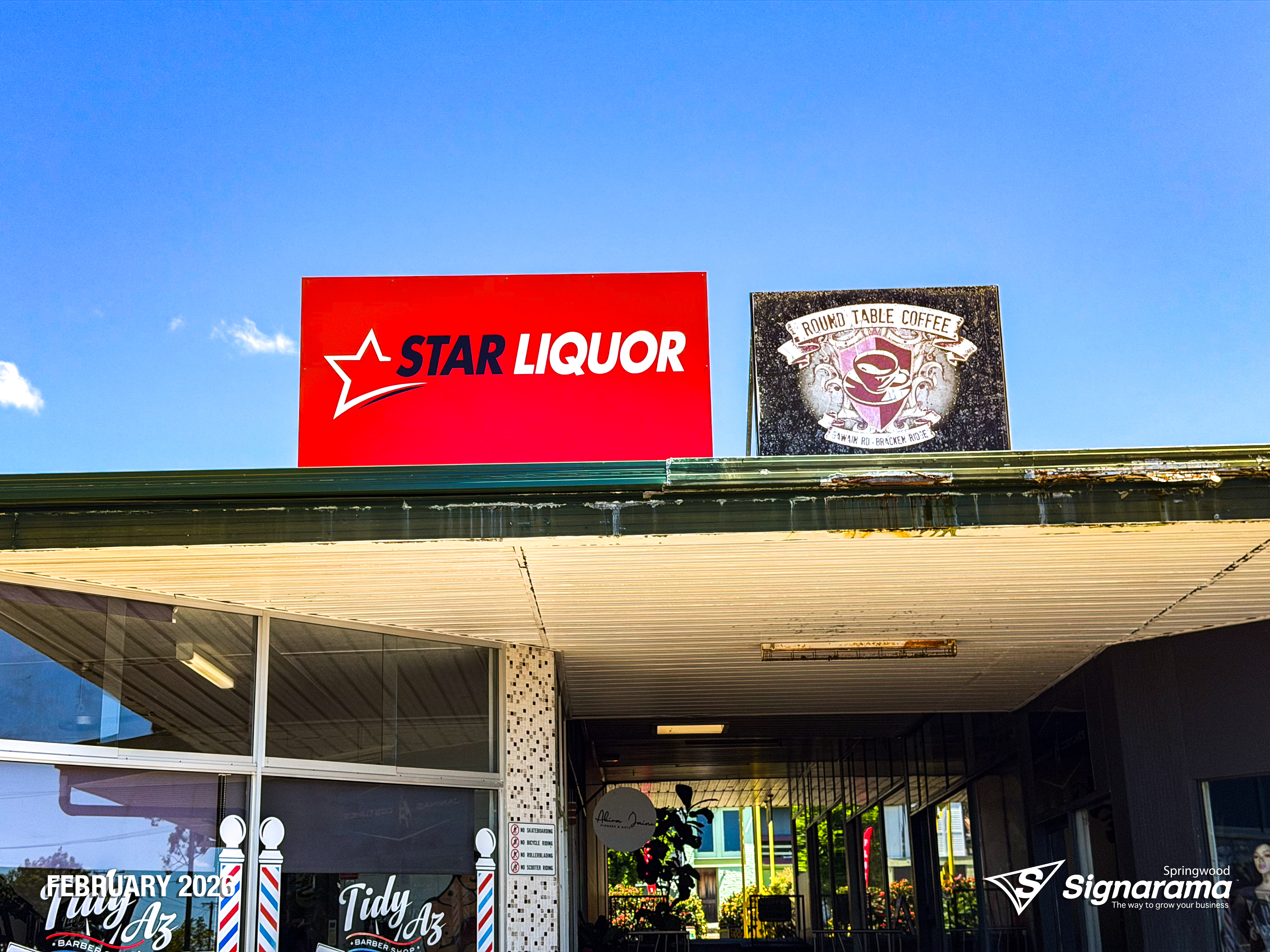 Exterior and interior signage installed by Signarama Springwood at a Star Liquor store, featuring illuminated storefront branding and cohesive in-store graphics for a complete reta...