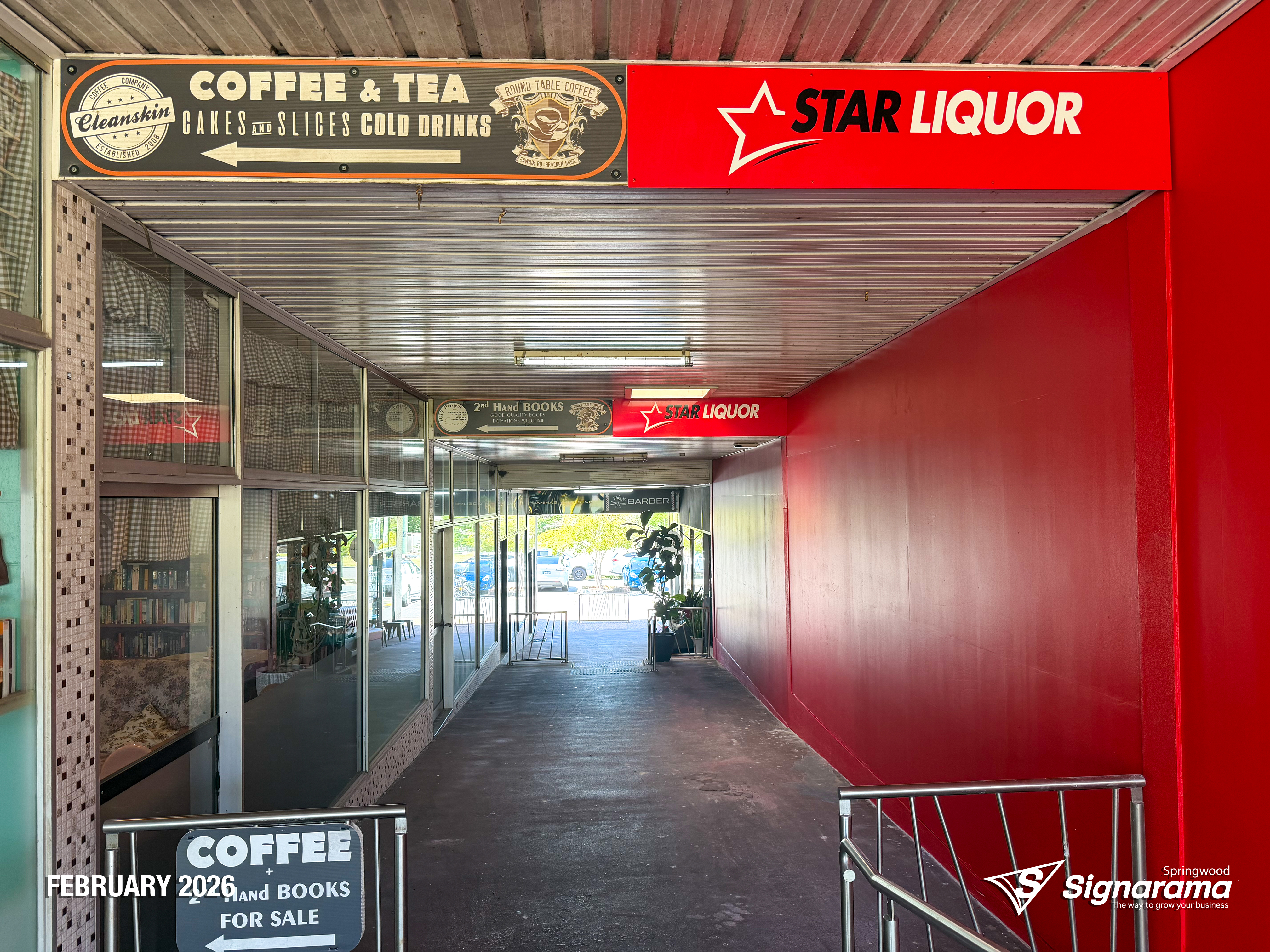 Exterior and interior signage installed by Signarama Springwood at a Star Liquor store, featuring illuminated storefront branding and cohesive in-store graphics for a complete reta...