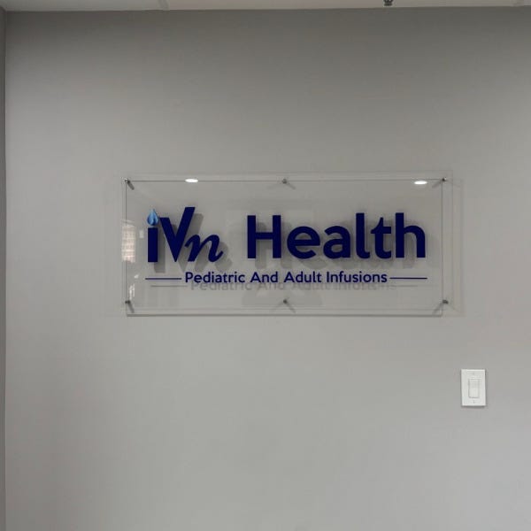 Custom Office Signage for IVN Health in Gaithersburg, MD | Reception Signs, Door Graphics & Parking Signs