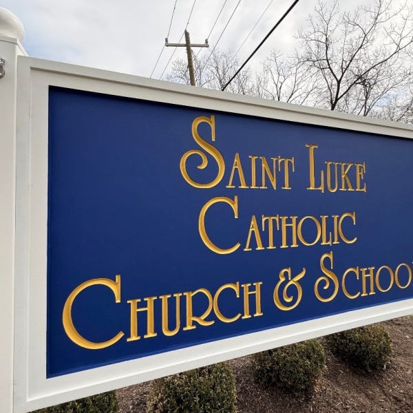 Custom HDU Post & Panel Entrance Sign for Saint Luke Catholic Church & School in McLean, VA | Royal Blue & Gold Church Signage