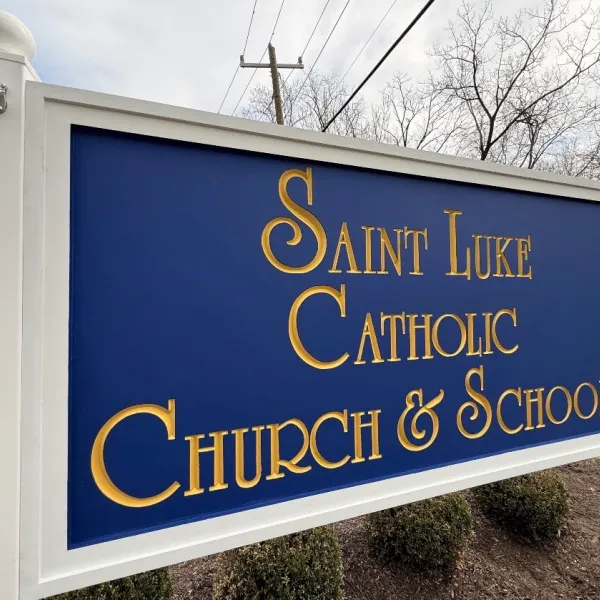 Custom HDU Post & Panel Entrance Sign for Saint Luke Catholic Church & School in McLean, VA | Royal Blue & Gold Church Signage