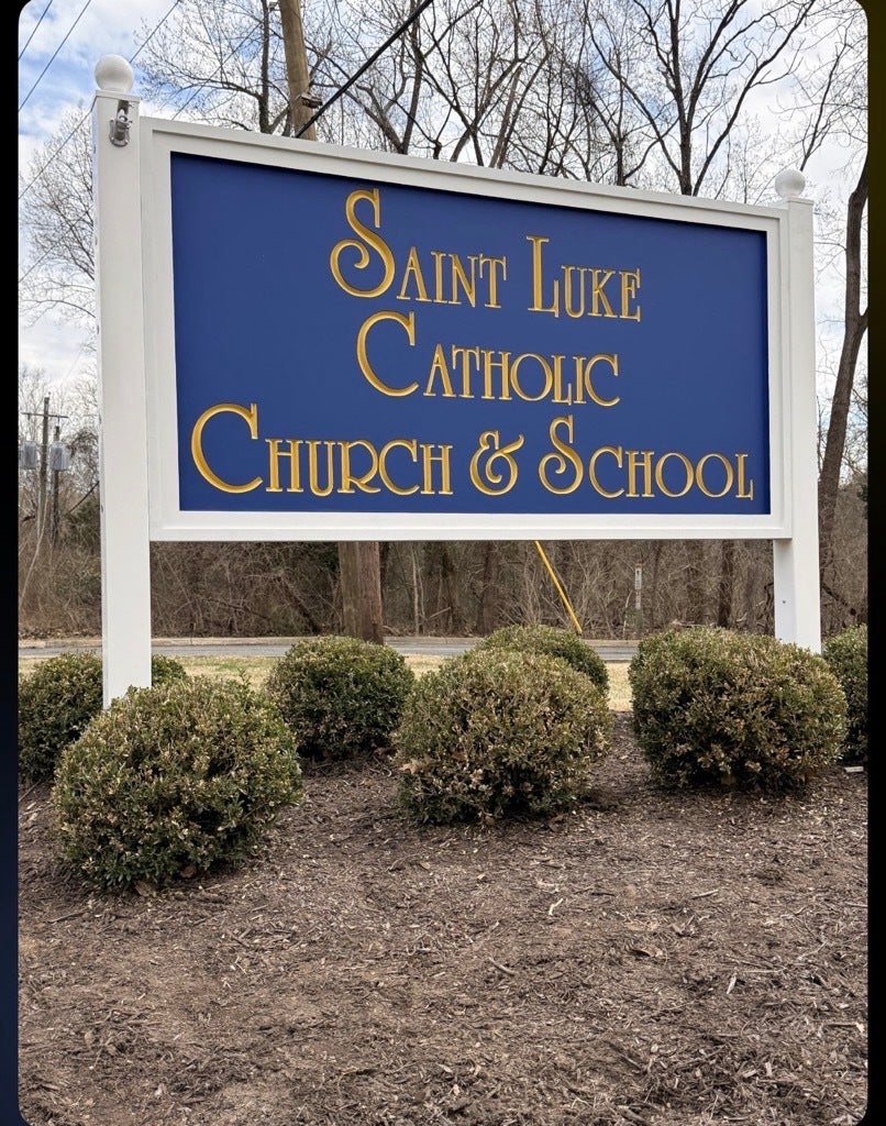 Custom HDU Post & Panel Entrance Sign for Saint Luke Catholic Church & School in McLean, VA | Royal Blue & Gold Church Signage