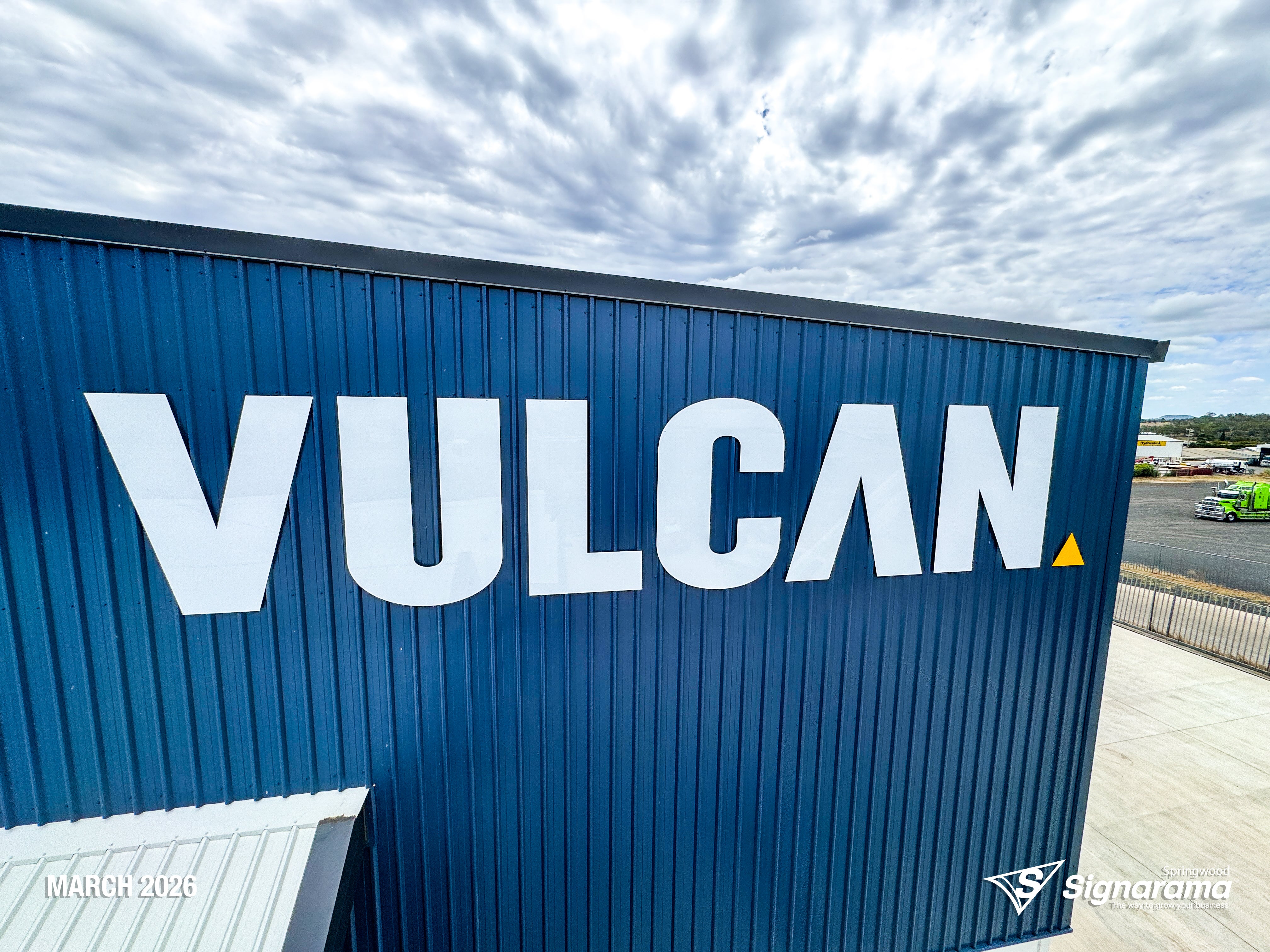 Large ACM cut building letters and precision vinyl cut lettering installed by Signarama Springwood for Vulcan Steel in Toowoomba, Queensland, featuring bold exterior signage mounte...