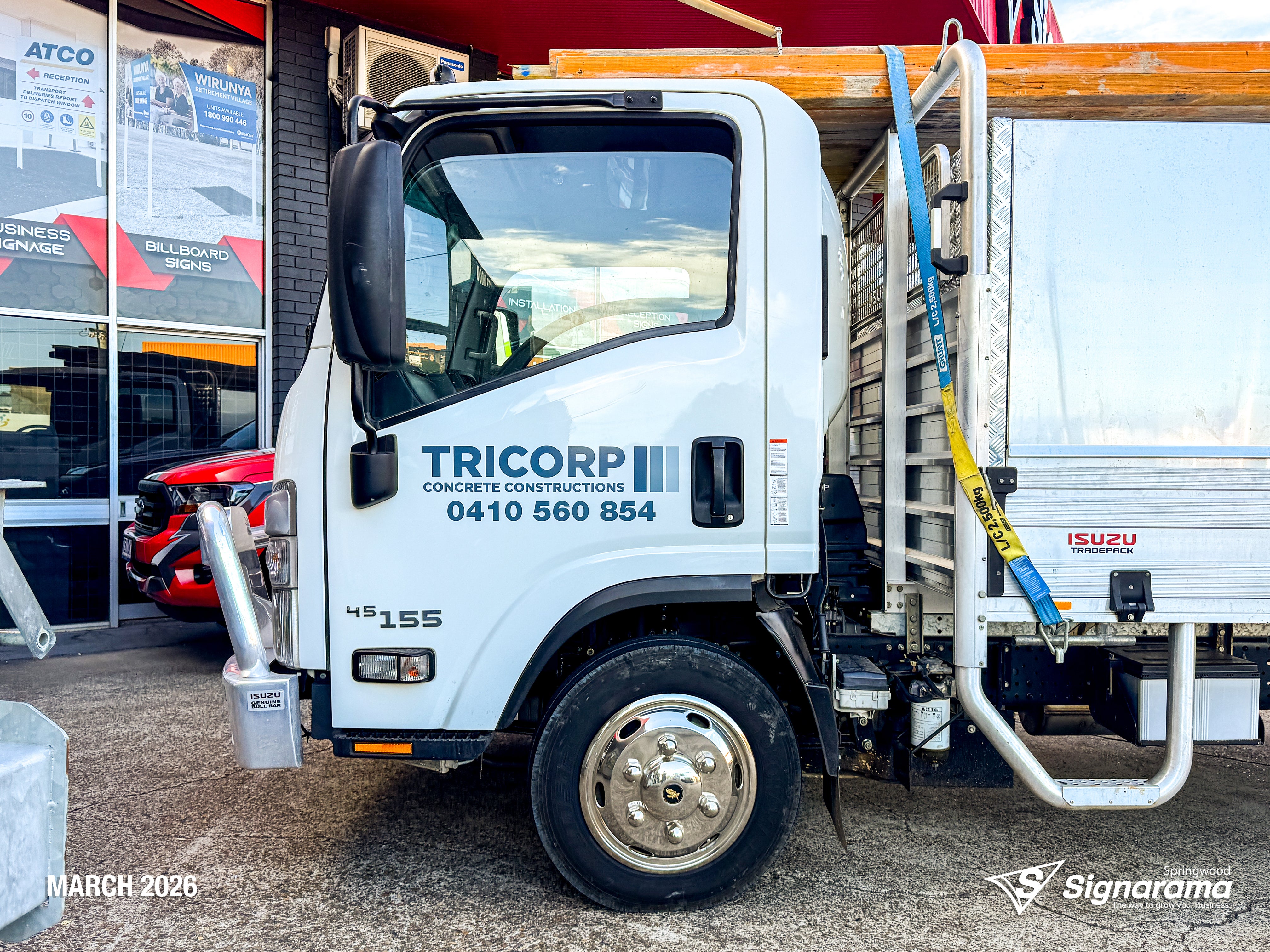 Signarama Springwood truck door vehicle graphics installed for Tricorp Concrete Constructions, featuring professional business branding on a work truck for mobile advertising.