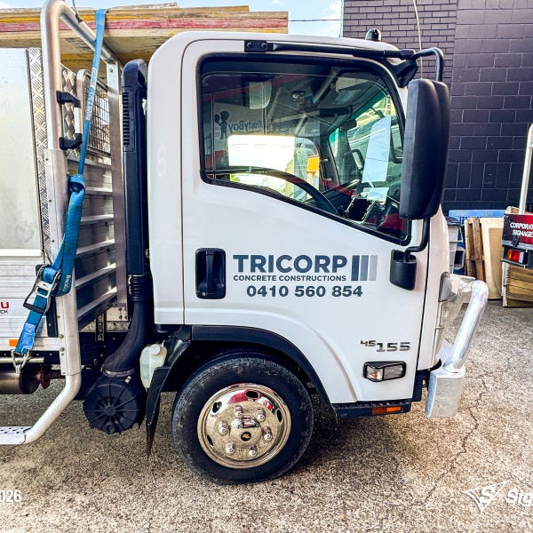 Signarama Springwood truck door vehicle graphics installed for Tricorp Concrete Constructions, featuring professional business branding on a work truck for mobile advertising.