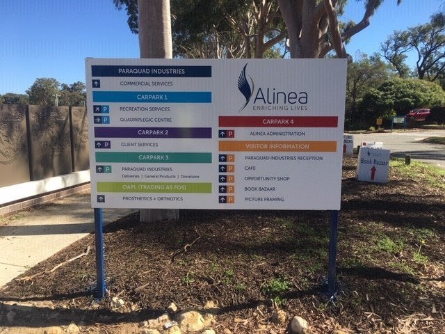 A large directional sign for wayfinding outside a business park