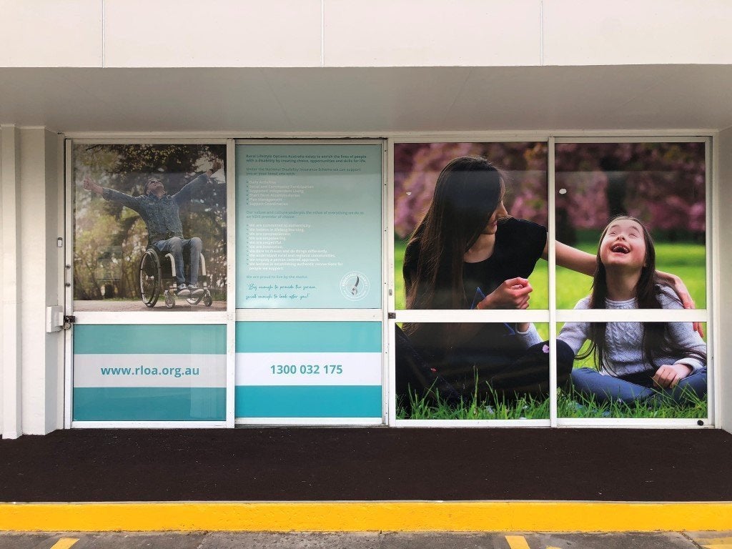Full Signage solution. Sail Track Banner fascia sign with One Way Vision and high gloss Vinyl Window Graphics.