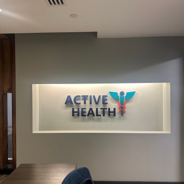 Backlit indoor reception sign for Active Health clinic in Northern Virginia