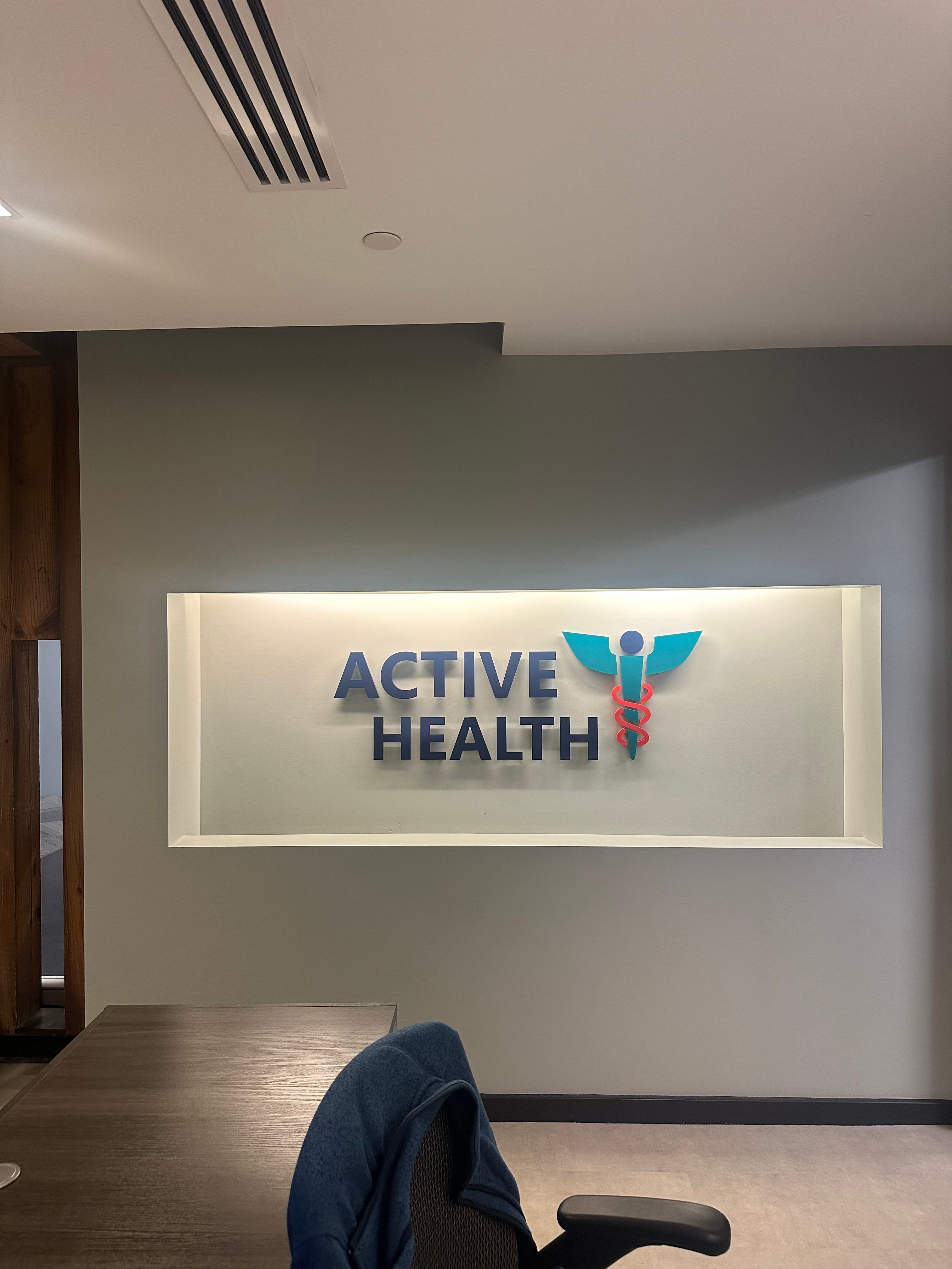 Backlit indoor reception sign for Active Health clinic in Northern Virginia