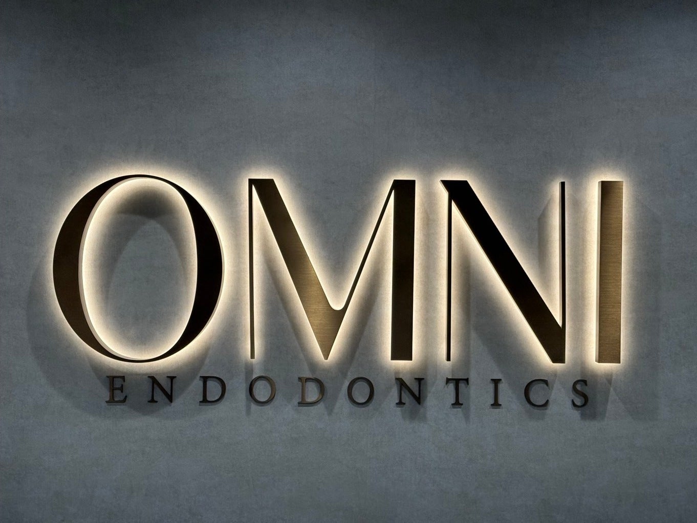 Lobby Sign Upgrade in Northern VA | Omni Endodontics Bronze Dimensional Letters Added for Elevated Branding