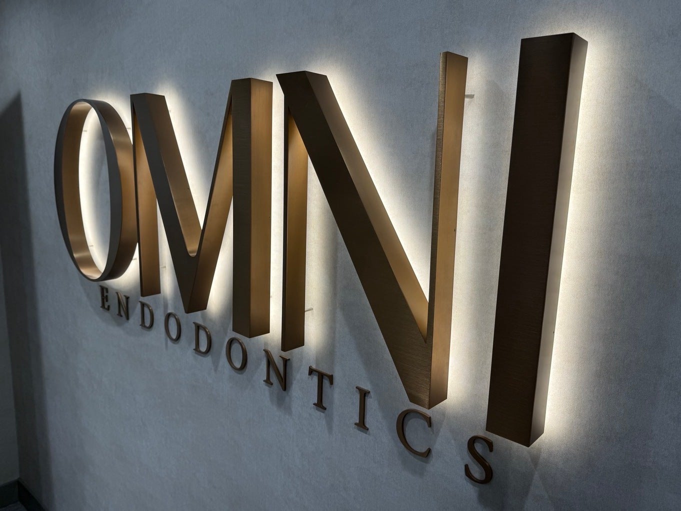 Lobby Sign Upgrade in Northern VA | Omni Endodontics Bronze Dimensional Letters Added for Elevated Branding
