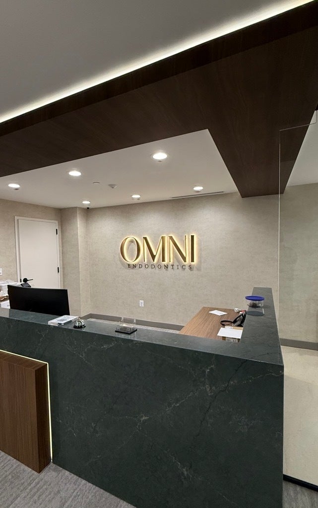 Lobby Sign Upgrade in Northern VA | Omni Endodontics Bronze Dimensional Letters Added for Elevated Branding