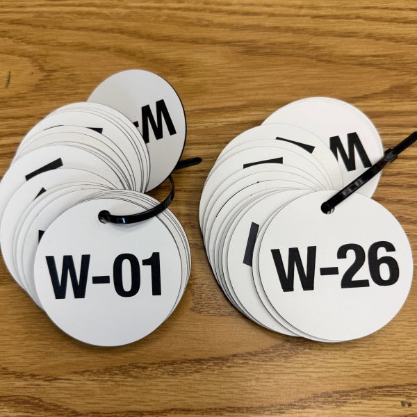 Round White Lamacoid Discs for Larlyn Prop Management in Edmonton, AB