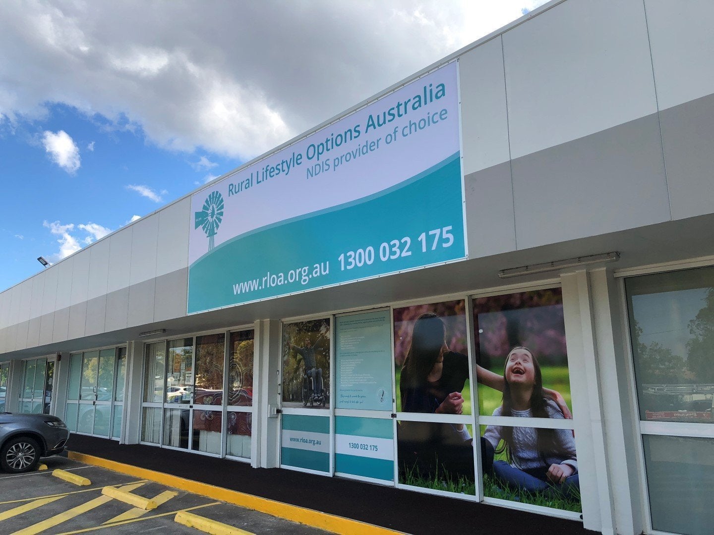 Full Signage solution. Sail Track Banner fascia sign with One Way Vision and high gloss Vinyl Window Graphics.