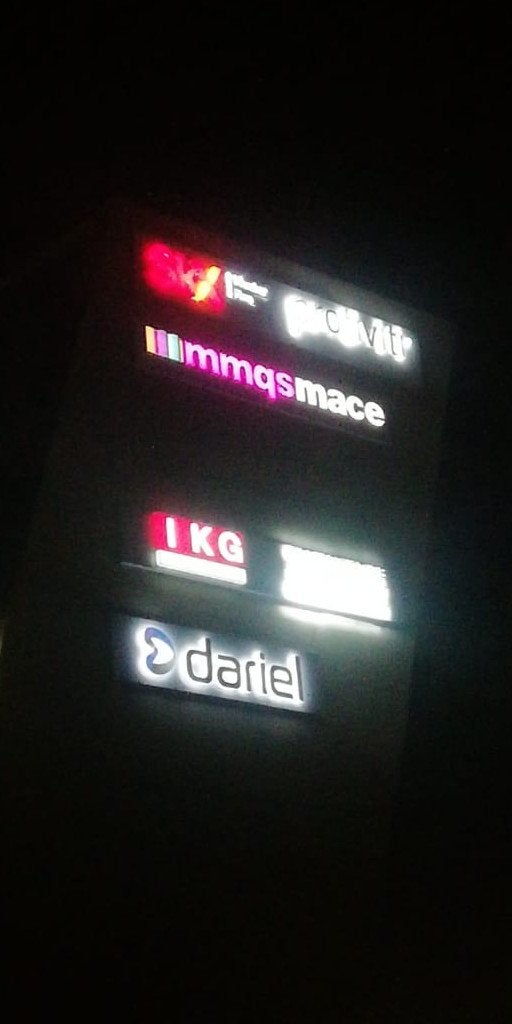 Dariel and Sekela Xabiso Perspex Fabricates Building Signage