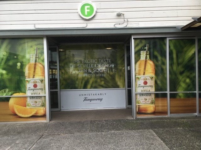 Window Graphics for retail shop entrance greenery with products
