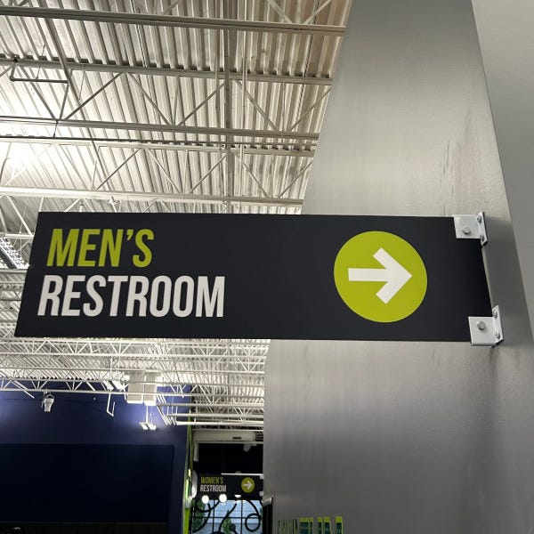 Directional restroom sign for men's restroom with arrows