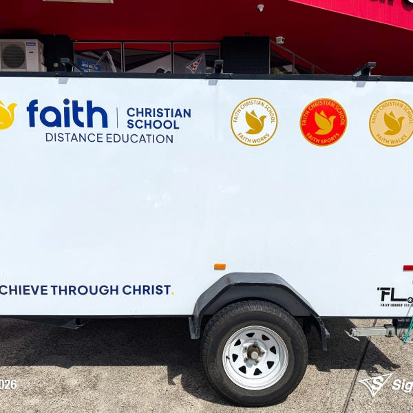 Trailer graphics installed by Signarama Springwood for Faith Christian School, featuring bold, professional vinyl graphics applied to a trailer for mobile branding and increased vi...
