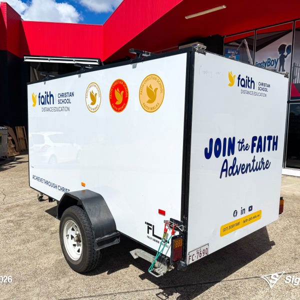 Trailer graphics installed by Signarama Springwood for Faith Christian School, featuring bold, professional vinyl graphics applied to a trailer for mobile branding and increased vi...