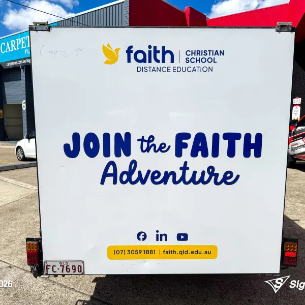 Trailer graphics installed by Signarama Springwood for Faith Christian School, featuring bold, professional vinyl graphics applied to a trailer for mobile branding and increased vi...