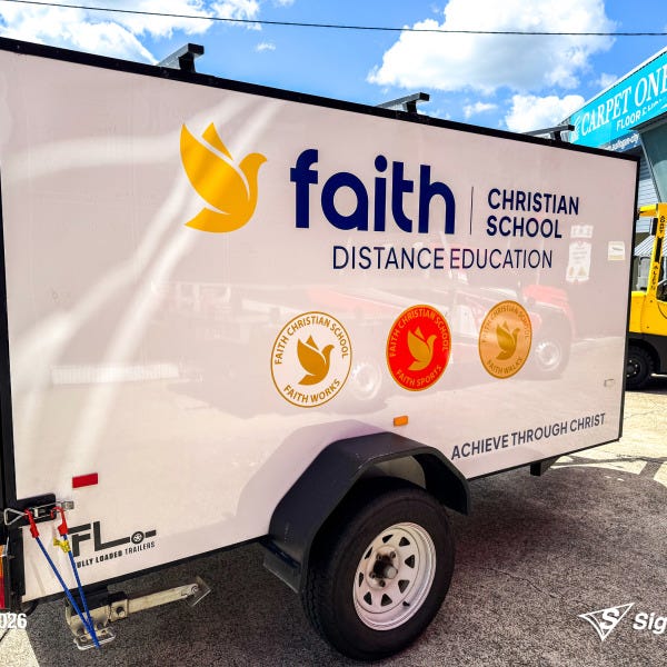 Trailer graphics installed by Signarama Springwood for Faith Christian School, featuring bold, professional vinyl graphics applied to a trailer for mobile branding and increased vi...