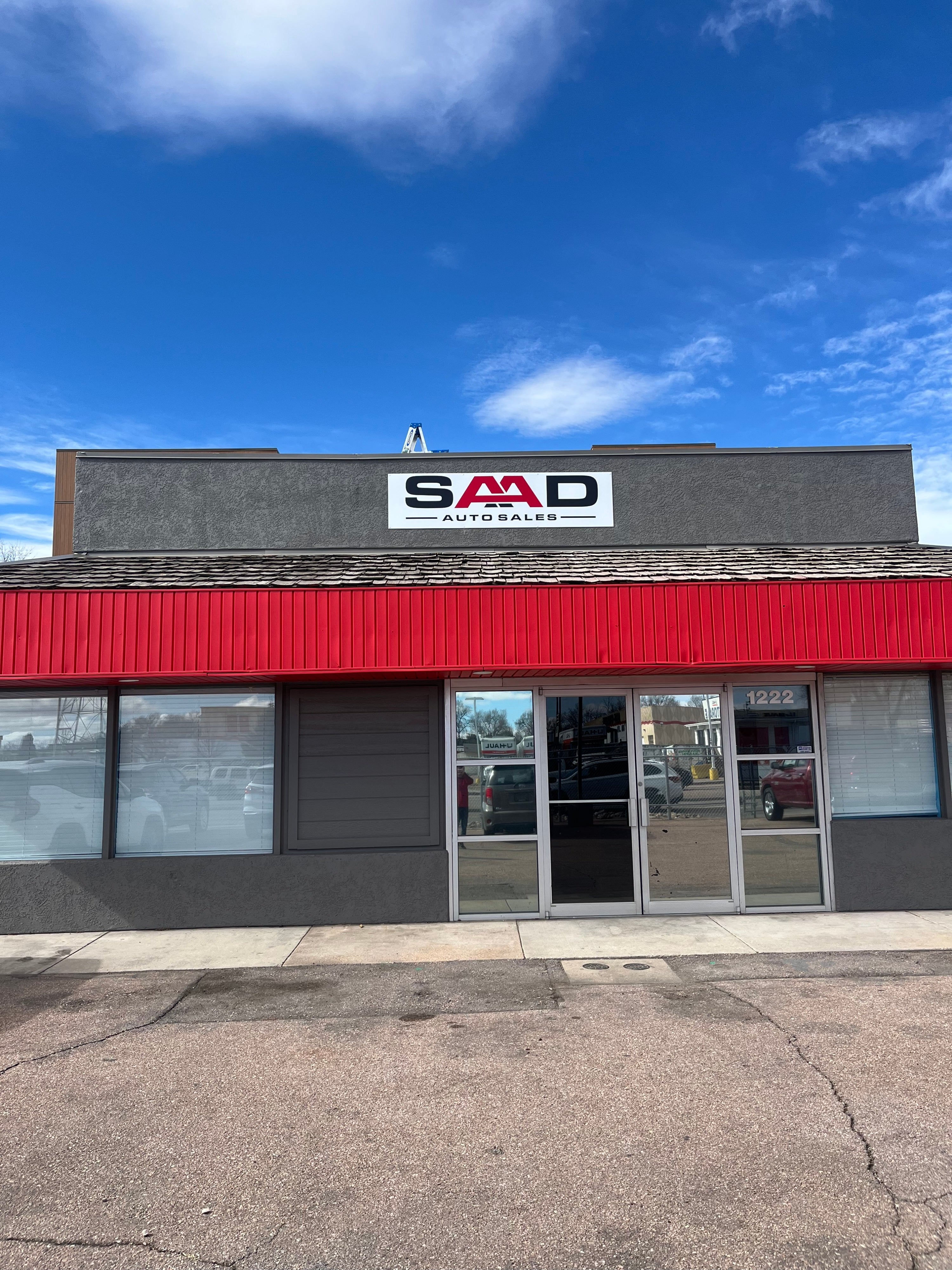 From Design to Installation: How We Built a Bold Building Sign for SAAD Auto Sales in Colorado Springs