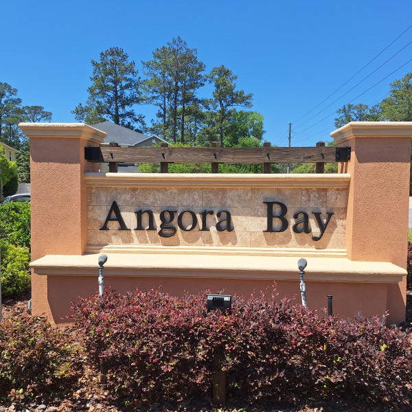 Refaced Monument Sign. Painted pillars, wooden structure and dimensional letters for Angora Bay Community.