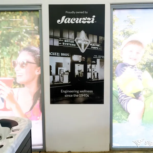Banners and front door graphics designed and installed by Signarama Springwood for Spa World Underwood, refreshing storefront signage with modern branding