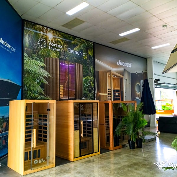 Banners and front door graphics designed and installed by Signarama Springwood for Spa World Underwood, refreshing storefront signage with modern branding